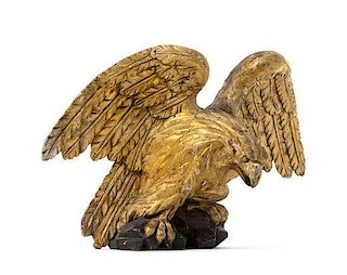 A Carved Giltwood Eagle Applique Height 14 x width 22 inches.