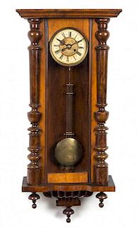A Victorian Walnut Regulator Clock Height 41 inches.