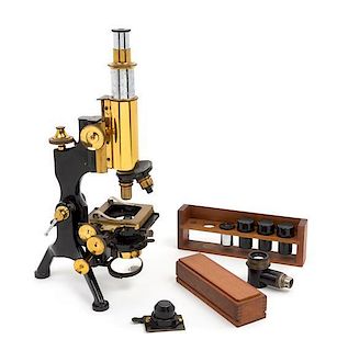 An English Brass and Black Lacquered Microscope Height 12 inches.