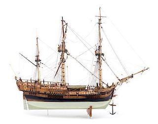 A Wooden Model of the Naval Research Vessel HMS Endeavor Height 25 x width 31 inches.