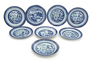 A Group of Eight Canton Blue and White Dinner Plates Diameter of largest 9 inches.