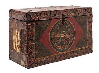 A Tibetan Painted Leather Chest Height 16 1/4 x width 26 3/4 x depth 10 5/8 inches.