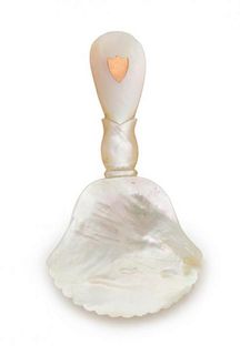 * A Palais Royal Mother-of-Pearl Caviar Spoon, , having a scallop-form bowl, the handle with an inset git-metal shield cartou