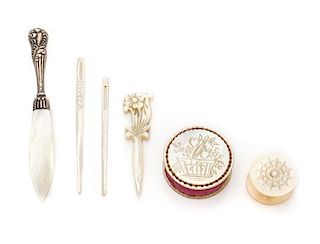 * A Collection of Six Mother-of-Pearl Sewing Articles, , comprising a stiletto, thread winder, two bodkins and a pin cushion.