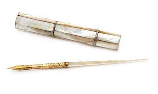 * A Mother-of-Pearl Etui, , the paneled cylindrical body having lids at the poles enclosing a thimble case and a compartment 