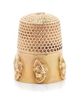 * An American 14-Karat Yellow Gold Dolly Varden Thimble, Goldsmith, Stern & Co., New York, NY, the knurled top and body above