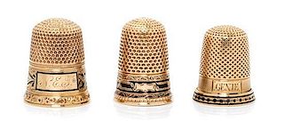 * Three American Yellow Gold and Enamel Thimbles, Various Makers, each having a knurled top and body above a black enamel ban