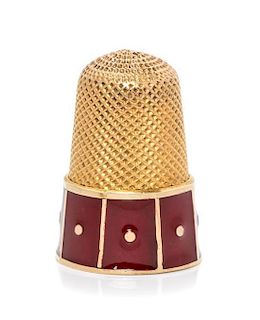 * A Yellow Gold and Enamel Thimble, , the base decorated with red enamel panels.