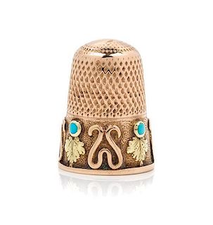 * A Bi-Colored Gold and Turquoise Thimble, , the knurled top and body above the foliate and wrigglework decorated band bearin