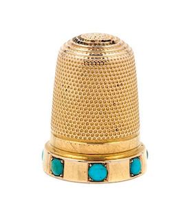 * A Yellow Gold and Turquoise Thimble, , the knurled top and body above the base inset with turquoise cabochons.