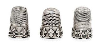 * A Group of Three Silver Thimbles, Various Makers, each having a knurled top and body above a band worked to show fleurs-de-