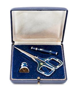 * A German Silver and Enamel Three-Piece Sewing Kit, , comprising scissors, a thimble and a needle case, each having a dark b