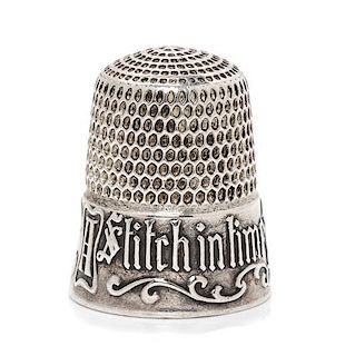 * An American Silver Thimble, Simons Bros., Philadelphia, PA, the based marked A Stitch in Time Saves Nine with a vacant cart
