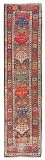 A Northwest Persian Wool Runner 12 feet 6 inches x 3 feet 4 inches.