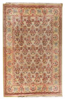 An Indo-Persian Wool Rug 13 feet 6 inches x 9 feet 10 inches.