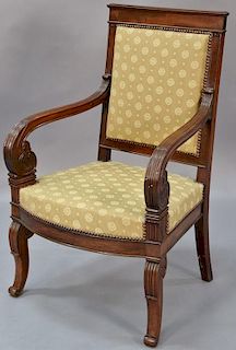 Continental mahogany armchair on sabre style carved leg, early 19th century.