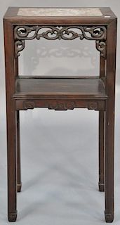 Chinese hardwood stand having marble top over carved skirt and one shelf.  ht. 32in., top: 12" x 16"  Provenance:  Estate of 