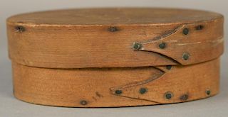 Shaker oval pantry box, three finger with copper points and tacks.  ht. 2 1/4in., lg. 6 1/4in. Provenance:  Estate of Arthur 