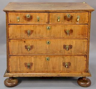 Queen Anne carved and burl walnut veneered chest of drawers, the rectangular top above a case with two short over three long 