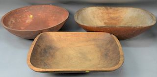 Three piece lot to include a large red painted and turned wood bowl and two troughs.  bowl: dia. 21 1/4in.  troughs: lg. 22in