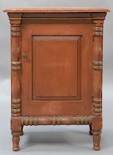 Sheraton diminutive one door cupboard with turned columns on turned legs, in old red paint, circa 1830.  ht. 28in., top: 11" 