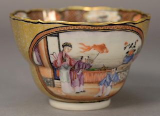 Chinese export porcelain tea cup with heavy gilt scrolling leaves and painted Guanyin with boys. 
ht. 2 3/8in., dia. 3 1/2in.