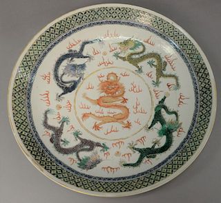 Chinese Famille Rose dragon charger having four painted five claw dragon around center dragon with flaming clouds, incised cl