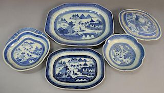 Five Chinese Canton blue and white serving pieces to include two platters, covered serving tureen, scallop edged bowl, and a 