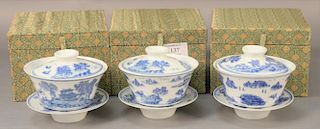 Set of three Chinese blue and white porcelain covered tea cups with saucers, inverted bellform decorated with landscape scene