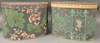 Two large oval wallpaper band boxes, both cardboard with floral decoration and blue ground.  ht. 11in., top: 12 1/4" x 15 3/4