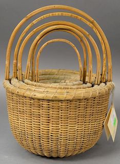 Nest of six Nantucket type baskets signed by Richard Goding Lisbon Maine 1992, all signed. 
dia. 4in. to dia. 9in.
