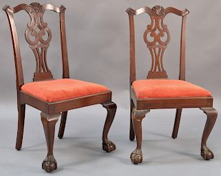 Pair of Chippendale mahogany side chairs with pierced carved backs and slip seats, set on cabriole legs ending in ball and cl