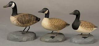 Three Albert J. Ditman (1884-1974) hand carved and hand painted miniature duck decoys on chip carved bases to include "Canada