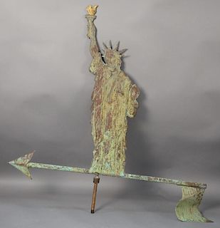 Statue of Liberty molded copper weathervane standing on arrow with American Flag end holding a gilt torch.  total ht. 40in., 