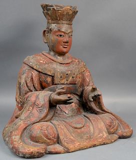 Large Chinese carved and red painted gesso seated Buddha with glass eyes wearing a flowing robe with legs crossed, signed on 