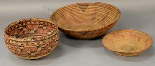 Three coiled Indian baskets, each with decoration.  largest: dia. 15 3/4in. Provenance:  Estate of Arthur C. Pinto, MD