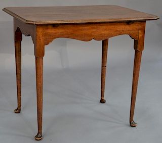 Mahogany Queen Anne tea table, shaped top with applied molded edge on base with scalloped skirt, on turned legs and pad feet,