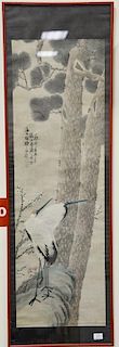 Framed Oriental scroll watercolor on paper, two cranes next to blossoming tree and tall pines, signed and seal mark left side