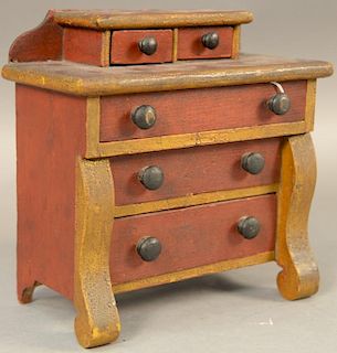 Salesman sample two over three drawer chest in old red and yellow paint.  ht. 8 1/2in., wd. 8in. Provenance:  Estate of Arthu