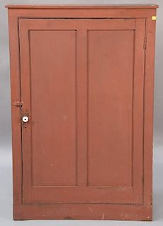 Primitive one door cupboard with recessed panels.  ht. 50in., wd. 32 1/2in., dp. 10in. Provenance:  Estate of Arthur C. Pinto