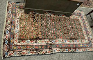Oriental throw rug. 
3'8" x 6'8"