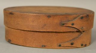 Shaker oval pantry box, three reverse finger with copper points and tacks.  ht. 2 5/8in., lg. 7 1/4in. Provenance:  Estate of