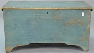 Primitive blanket chest with lift top in original blue paint on cut out bracket base. 
ht. 23 1/4in., wd. 41 1/4in., dp. 18 1