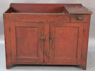 Primitive dry sink with one drawer over two doors on plain feet in old red paint, possibly original, 18th century.  ht. 36in.