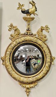 Girandole mirror with serpent atop a pedestal flanked by dolphins over convex mirror. 
ht. 37in., wd. 21in.