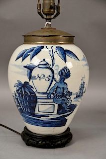 Dutch Delft blue and white tobacco jar N=5 having painted scene with Native Indian smoking a pipe before distant ships sittin