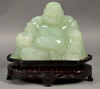 Large carved jade or jadeite figure of a seated buddha. 
figure: ht. 7 1/4in., lg. 10 1/2in.