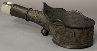 Chinese bronze iron having handle mounted with carved jade and horn archers ring. 
lg. 10in.