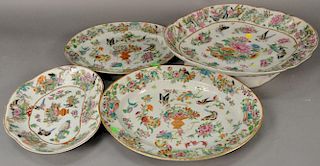 Four piece Famille Rose porcelain lot to include large footed platter, two oval platters and one shaped platter. 
footed plat