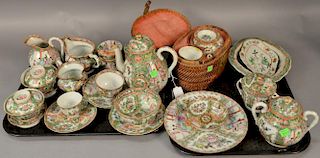 Twenty-five piece lot of Rose Famille porcelain to include teapot and matching cup in basket, coffee pot, two covered jars, t